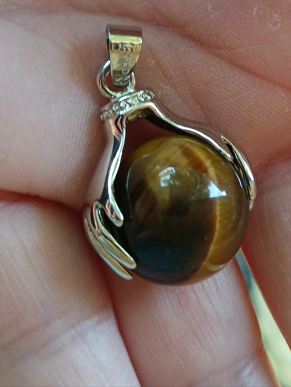 New 18K Hands Holding Tiger Eye Sphere Pendant.